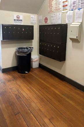 Los Angeles apartment for rent - A room with a black trash can and a no smoking sign.