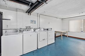 Los Angeles apartment for rent - A laundry room with a washer and dryer.