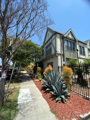 Los Angeles apartment for rent - A house with a grey roof and a black fence.