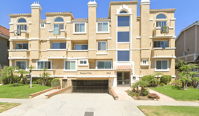 Los Angeles apartment for rent - A large building with a sign that says "Empress Village" on it.