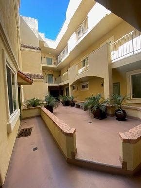 Los Angeles apartment for rent - A courtyard with a tiled floor and a few potted plants.