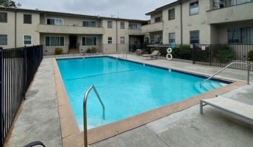 Los Angeles apartment for rent - A small pool in a courtyard surrounded by apartment buildings.