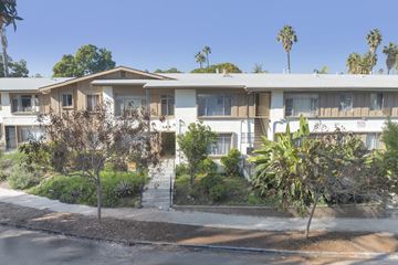 Los Angeles apartment for rent - Apartment complex with trees and bushes in front.