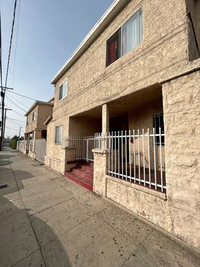 Los Angeles apartment for rent - A row of houses with a clear blue sky above.
