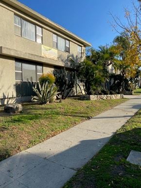 Los Angeles apartment for rent - A building with a yellow sign on it.