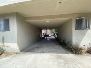 Los Angeles apartment for rent - A concrete covered driveway leads to a house.
