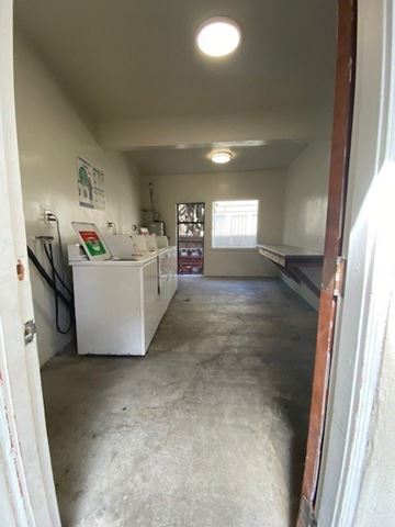 Los Angeles apartment for rent - A white kitchen with a sink and a window.