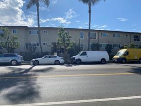 Los Angeles apartment for rent - A yellow van is parked on the side of the road.