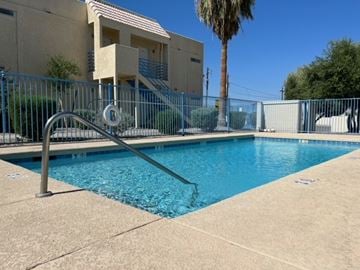 Bullhead City apartment for rent - A pool with a metal fence around it.