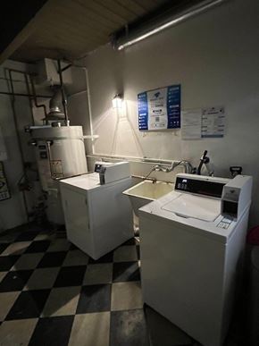 Beverly Hills apartment for rent - A white machine sits on a black and white checkered floor.