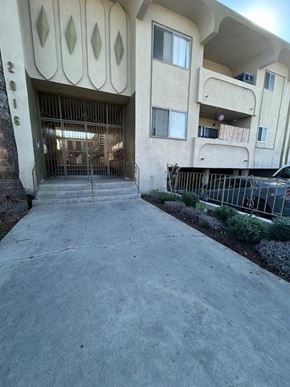 Los Angeles apartment for rent - A building with a large gate in front of it.