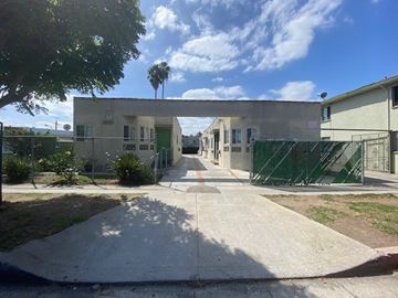 Los Angeles apartment for rent - A sunny day at a residential area with a pathway leading to a building.