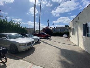 Los Angeles apartment for rent - A silver Dodge Charger is parked in a driveway.