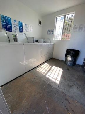 Los Angeles apartment for rent - A room with a white counter and a window with a view of a fence and trees.