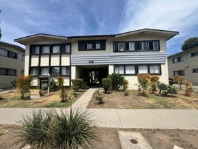 Los Angeles apartment for rent - A building with a white and beige facade has a sign that reads "Hill" on the front.