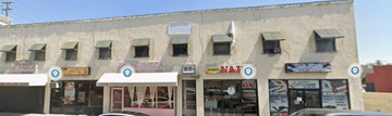 Maywood apartment for rent - A building with a sign that says NAT on it.
