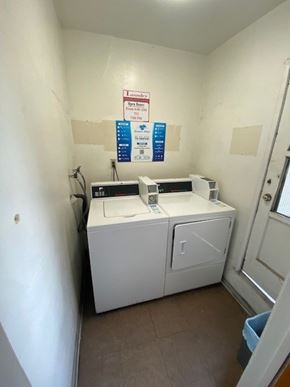 Maywood apartment for rent - A small laundry room with a washer and dryer.