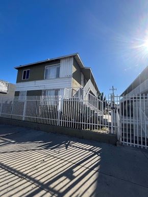 Los Angeles apartment for rent - A house with a white fence in front of it.