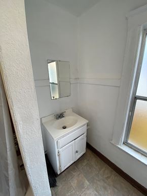 Los Angeles apartment for rent - A white bathroom with a sink and mirror.