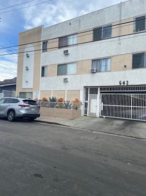 Los Angeles apartment for rent - A car is parked in front of a building with the number 643 on it.