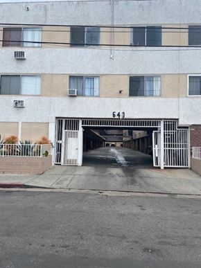 Los Angeles apartment for rent - A building with the number 643 on it has a white gate blocking the entrance.