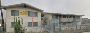 Compton apartment for rent - A house with a sign that says "Now Leasing".