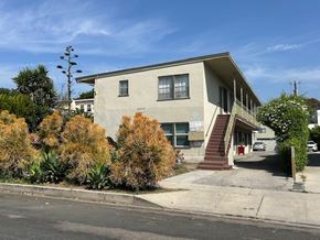 Los Angeles apartment for rent - A house with a grey facade and a red door.