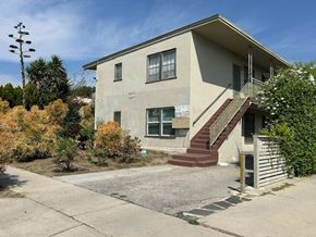 Los Angeles apartment for rent - A house with a beige facade and a red staircase.