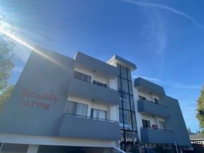 Los Angeles apartment for rent - A building with the words "Deadly Arms" painted on it.