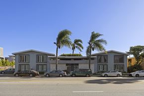 Los Angeles apartment for rent - A row of houses with cars parked in front.