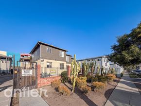 Los Angeles apartment for rent - A residential area with a house, gate, and cacti.