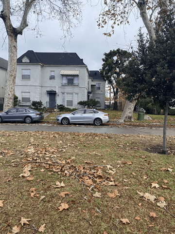 Los Angeles apartment for rent - Two cars parked in front of a house.