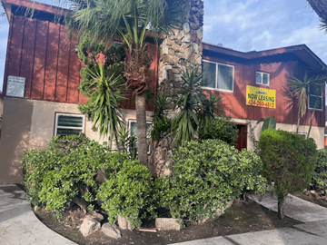 Inglewood apartment for rent - A building with a sign that says "NOW LEASING" and a phone number.