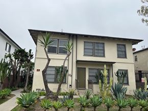Los Angeles apartment for rent - A house with a green door and a cactus in front.
