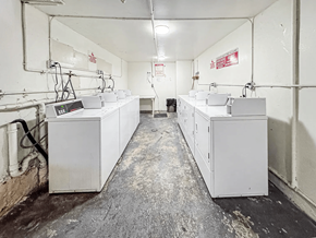 Los Angeles apartment for rent - A long industrial hall with lots of white boxes on the floor.