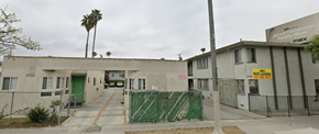 Los Angeles apartment for rent - A building with a green gate in front of it.
