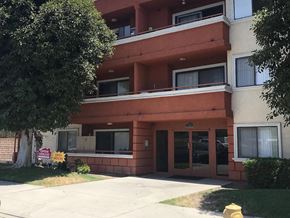 North Hollywood apartment for rent - A multi-story apartment building with a "For Rent" sign in front.