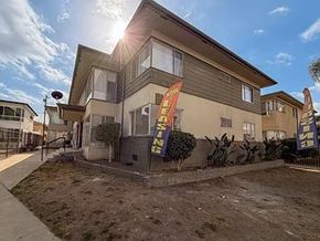 Los Angeles apartment for rent - A sunny day at a home for sale with a sign in front.