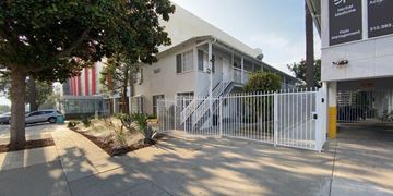 Santa Monica apartment for rent - A white building with a gate in front of it.
