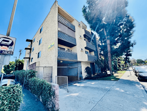 Los Angeles apartment for rent - A sunny day at a parking area with a building in the background.