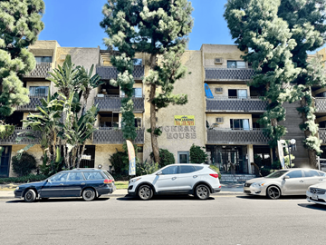 Los Angeles apartment for rent - A row of cars parked in front of a building with a sign that says "House".