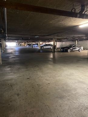 North Hollywood apartment for rent - A parking garage with a few cars parked in it.