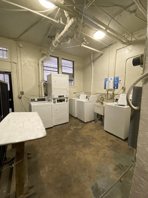 Los Angeles apartment for rent - A room with white appliances and a concrete floor.