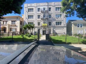 Los Angeles apartment for rent - A building with a black gate in front of it.
