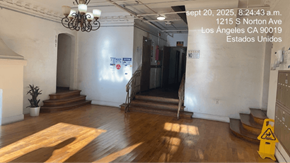 Los Angeles apartment for rent - A room with wooden floors and a chandelier.