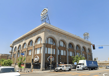 Los Angeles apartment for rent - A large building with a sign on the top of it.