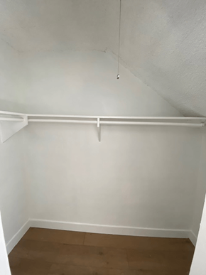 Los Angeles apartment for rent - A white wall with a wooden floor and a white ceiling.