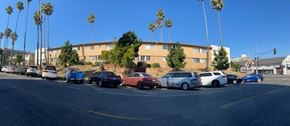 Los Angeles apartment for rent - Cars are parked on the side of the road.
