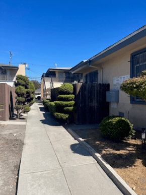 Los Angeles apartment for rent - A residential street with houses and a sidewalk.