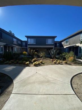Los Angeles apartment for rent - A modern house with a grey exterior and a concrete driveway.
